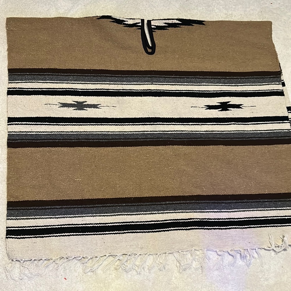 Black, tan, gray and white blanket poncho!  Very warm and dense.  Lined neck